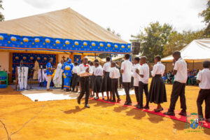 Newly confirmed youths aligned to receive Holy Communion from Monsignor Thawale