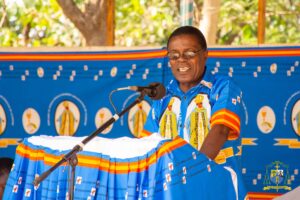 aula Deanery Chairperson Clement Sitambuli addresses the historic gathering from the podium, emphasizing unity and development within the deanery