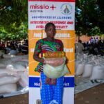 One of beneficiary carrying Cooking Oil and other Relief items during the launch of the project