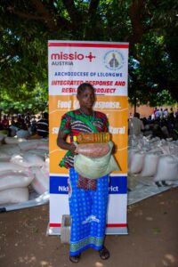 One of beneficiary carrying Cooking Oil and other Relief items during the launch of the project