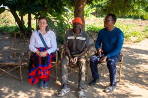 Lucia Bayer of Missio Austria, a beneficiary farmer, and the Archdiocesan Director of Social Services pose a photo