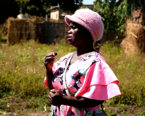 Towera explaining what she experienced before and after the coming in of the project