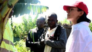 Josephy at his Banana plantation with Lucy Bayer from Missio and other visitors