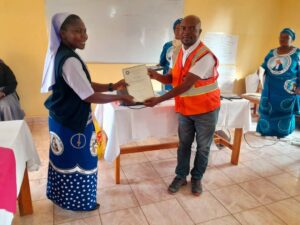 Project Coordinator Sister Teleza Mulenga also received her certificate from MBS Officer