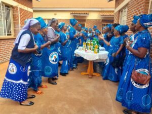Women singing, enjoying their fruits of making soap and body lotion