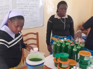 Packing the products that have been produced during the training. Dishwash soap and body lotion