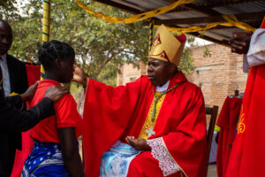 Bishop Mwakhwawa performs the sacrament of confirmation
