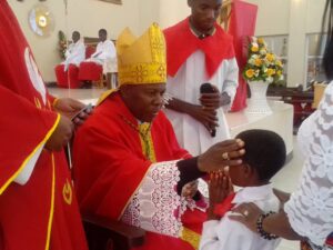 bishop Mwakhwawa conferring the sacrament