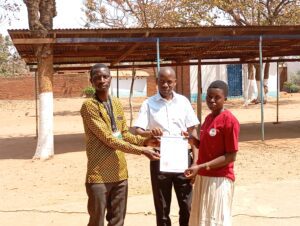 Mr Satha and Mr Chikafa poses with Naomi for a certificate receipt