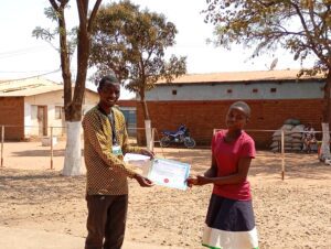 Mr Satha awarding a certificate to a trainee