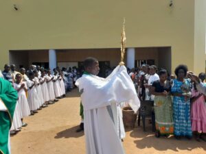Father Kanjira carrying the Eucharist for adoration