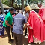 Friends of Likuni Parish presenting tiles to the Auxiliary Bishop