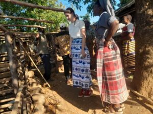 Brunner and Sister Mulenga, appreciating how the support groups are keeping their pigs