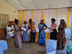 Graduating women receiving their certificates