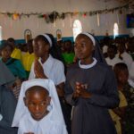 Reflecting the beauty of a religious calling, these young girls participate in the 75th Epiphany celebrations at Likuni Parish