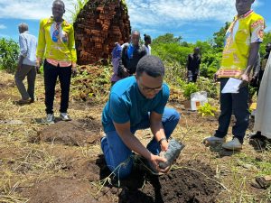 Brian Odhiambo, leads a tree-planting exercise at Senjere Primary School to help restore Nkhotakota’s environment