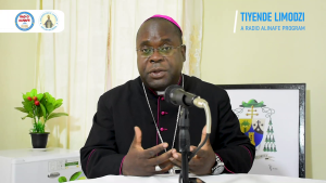 "Tiyende Limodzi—Let us walk together." Archbishop George Desmond Tambala at the bishop's house, launching the new Radio Alinafe program. Inspired by the Road to Emmaus, the Archbishop invites all faithful of the Lilongwe Archdiocese to join him in a journey of listening, prayer, and communal growth.