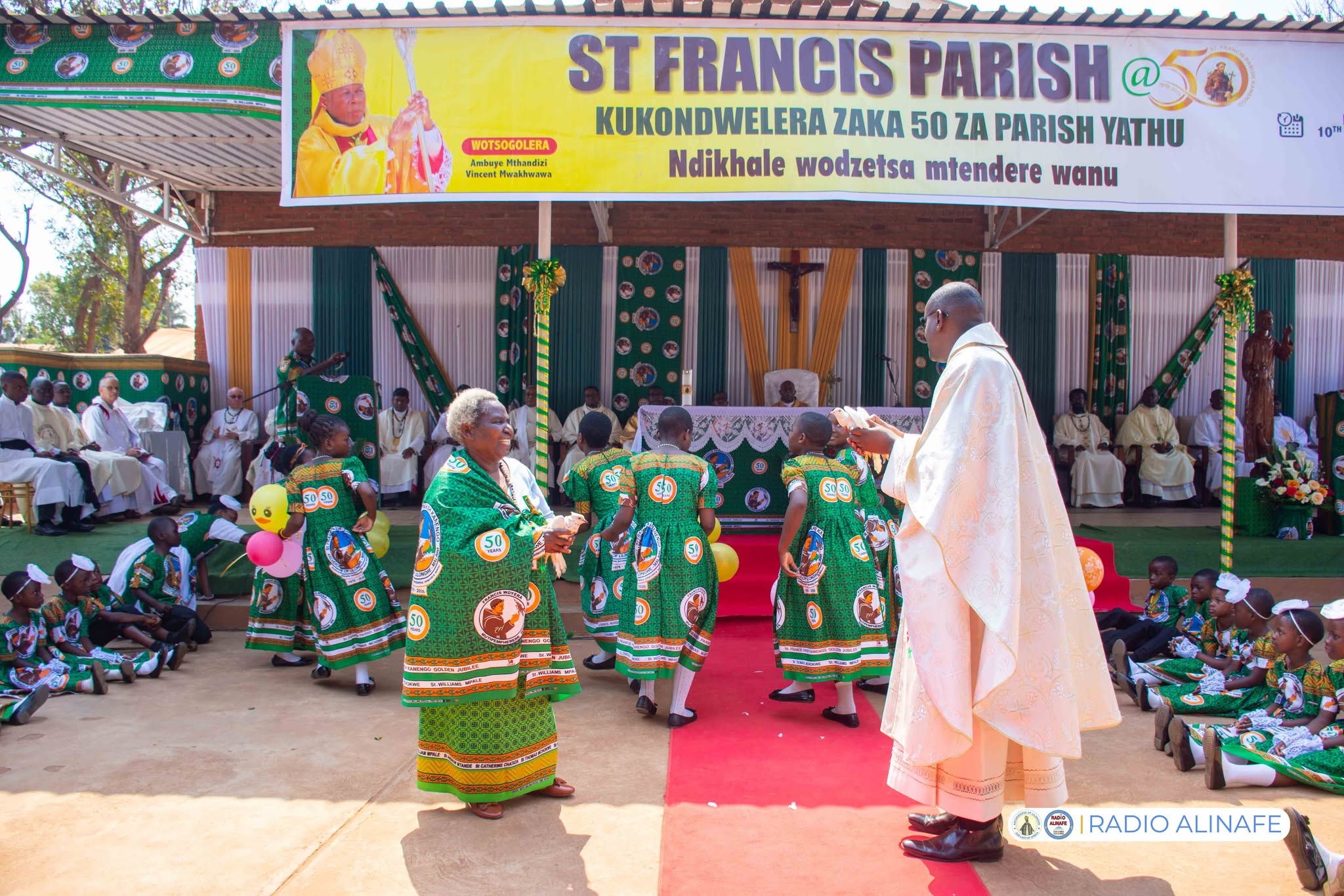 Fr. Muhineza with a long serving parishioner